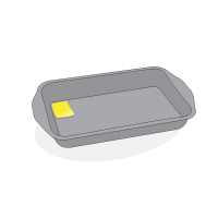 A rectangle cake pan, with a sticky note at the corner of the left side of the plate.